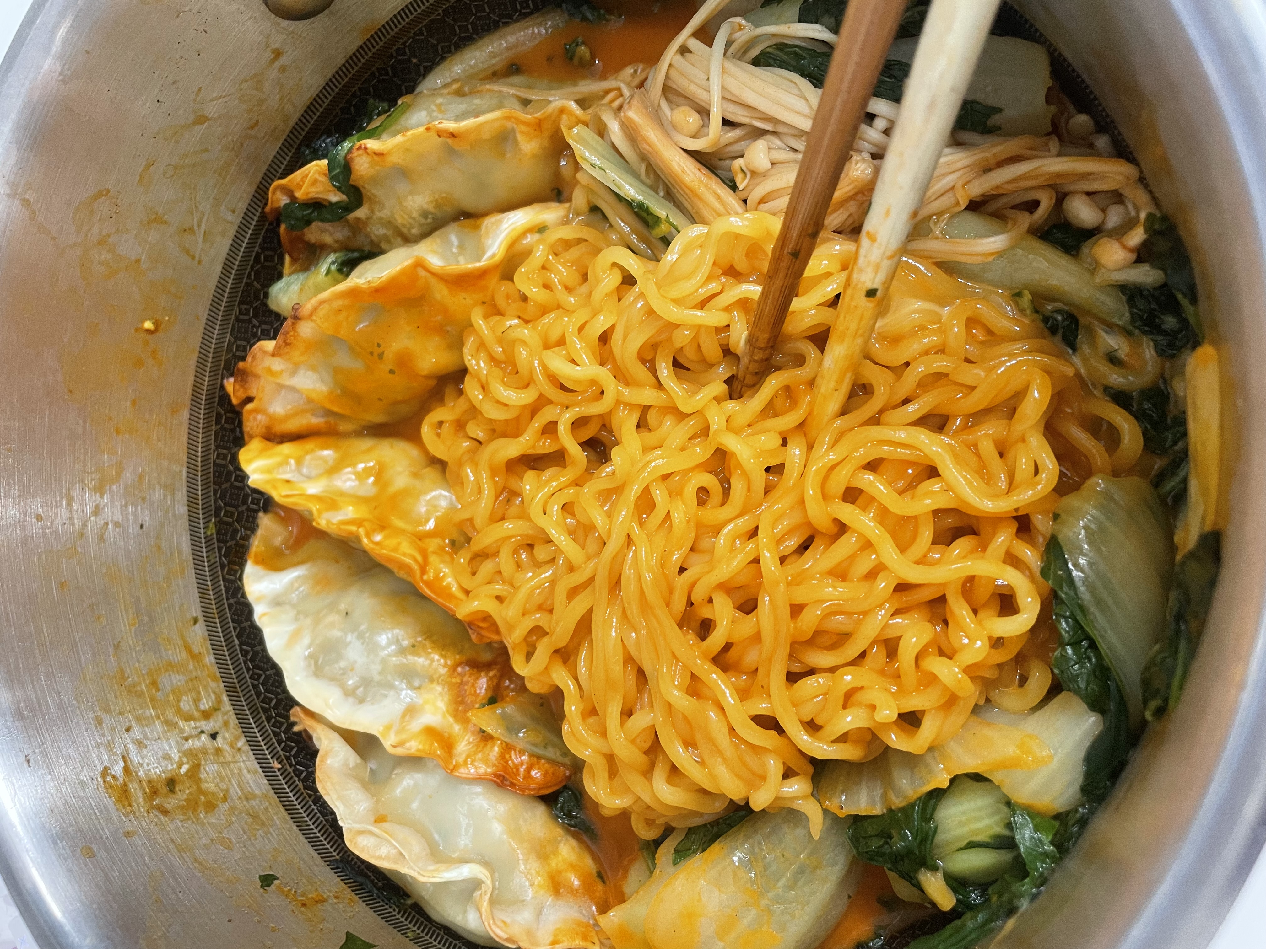 buldak with dumplings, mushrooms, and bok choy